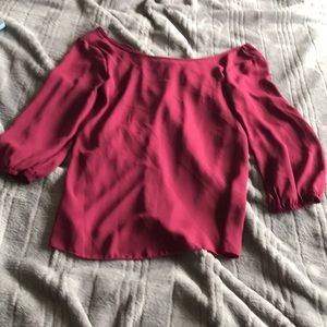 Maroon blouse and bow accent